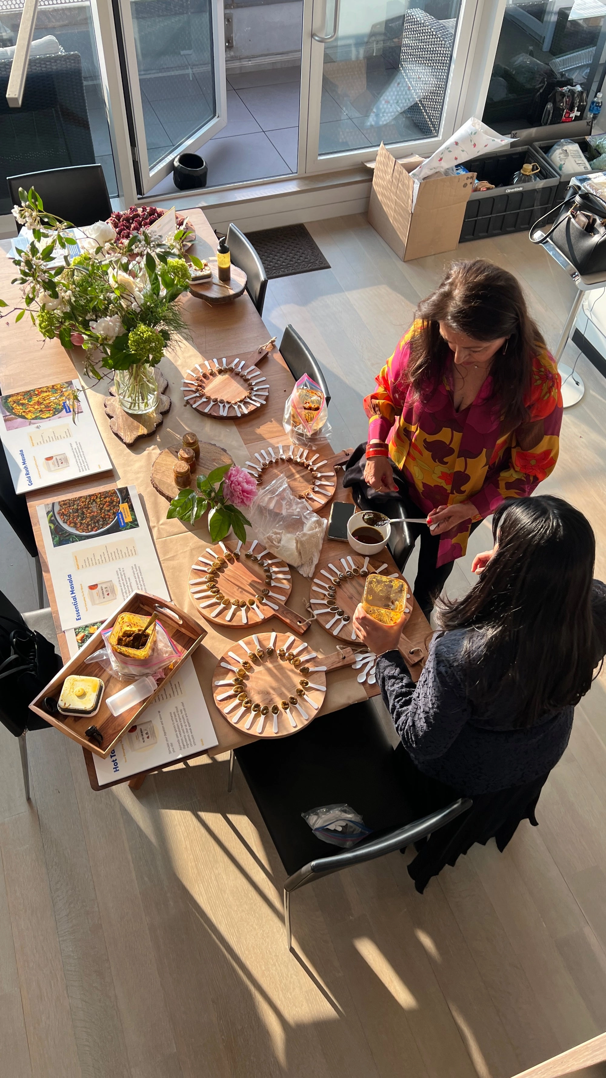 A tasting table seen from above, with guests serving themselves